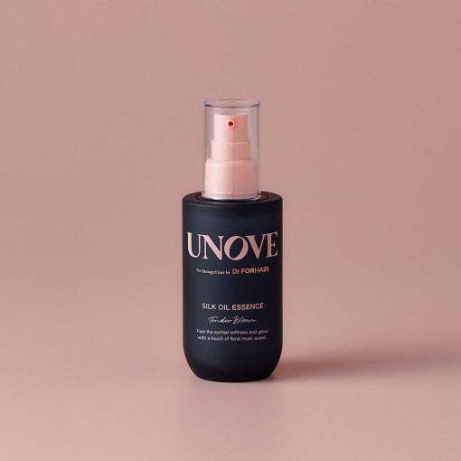 UNOVE Silk Oil Essence 70ml in matte black bottle with pump, perfect for restoring shine and softness to damaged hair.