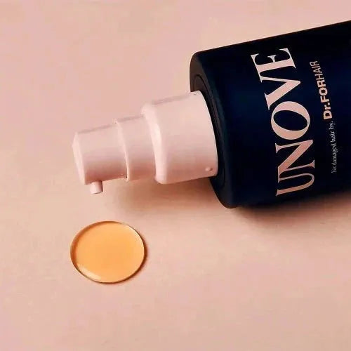 Close-up of UNOVE Silk Oil Essence with drop of product, highlighting its rich silk oil formula for hair revitalization.