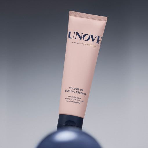 UNOVE Volume Up Curling Essence 147ml displayed on a gradient background, emphasizing its premium curl enhancing formula.