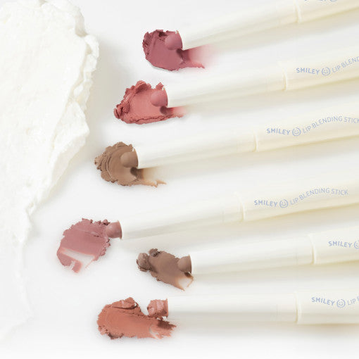 Lilybyred Smiley Lip Blending Stick 0.8g swatches in six nude and pink shades, showcasing creamy texture for lip lining and filling.