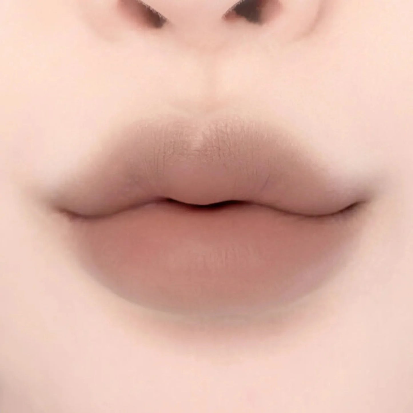Lips featuring Lilybyred Smiley Lip Blending Stick 0.8g in a cool taupe shade, ideal for subtle definition and contouring.