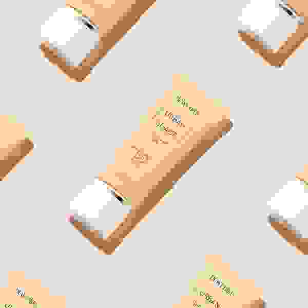 DEWYTREE Urban Shade Sun SPF50+ PA++++ flat lay with skincare items, conveying daily UV defense routine.