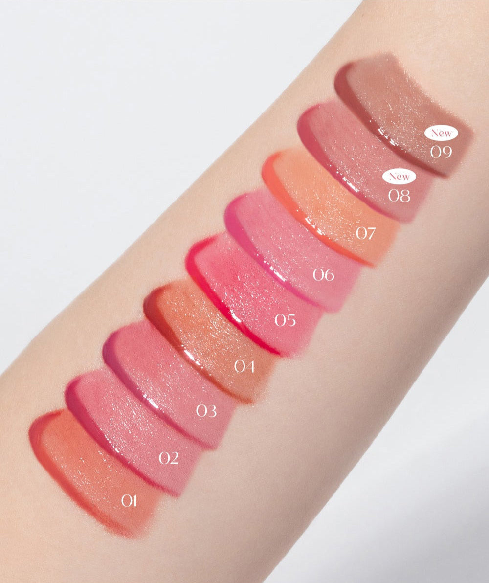 Swatches of all 9 BBIA L'eau Tint 4.5g shades on a forearm, showcasing the glossy, vibrant finish and color variety from peach to deep rose.