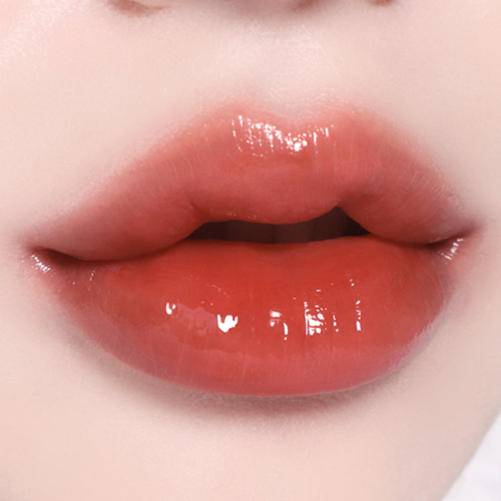Lips featuring BBIA L'eau Tint 4.5g in a coral orange hue, offering a fresh, radiant glow ideal for summer makeup looks.