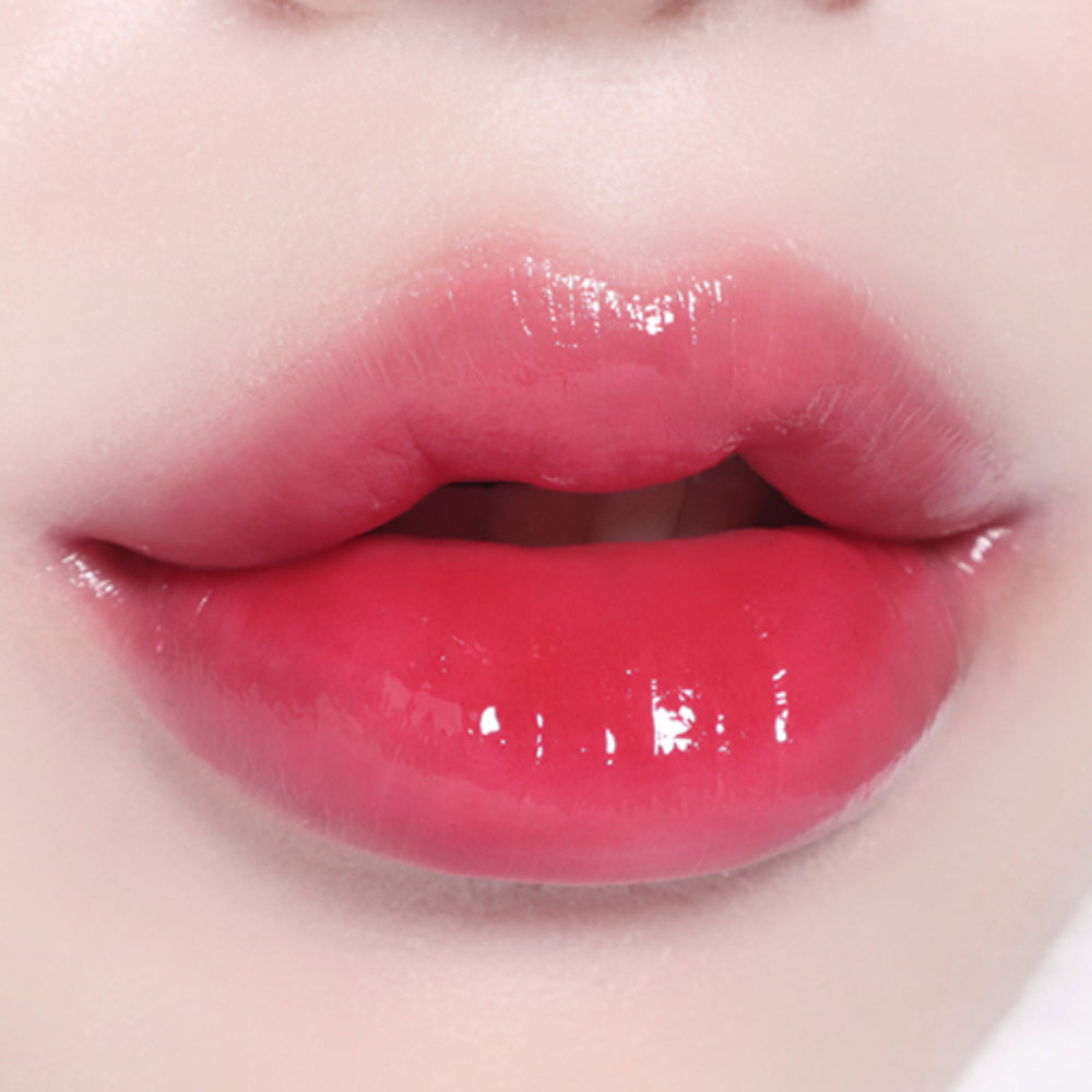 BBIA L'eau Tint 4.5g in a vivid pink shade on lips, delivering a bright, juicy finish with a lightweight, hydrating formula.