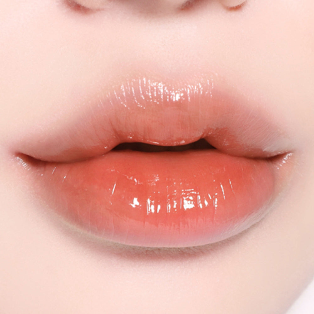 BBIA L'eau Tint 4.5g in a nude peach tone on lips, highlighting its smooth, glossy texture and everyday wearability.