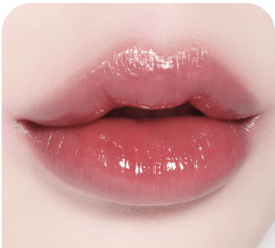 Lips wearing BBIA L'eau Tint 4.5g in a muted rose shade, offering a sophisticated, glossy finish with a barely-there feel.