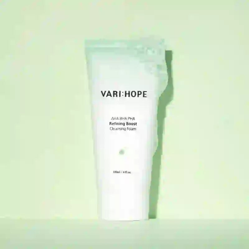 VARIHOPE Pore Deep Cleansing Foam 120ml tube against a pale green background, showcasing its refreshing cleansing properties.
