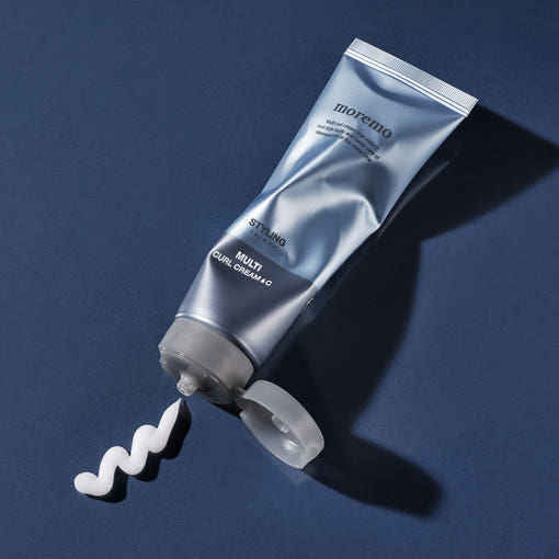 Opened tube of moremo Multi Curl Hair Cream C with cream texture visible. Men's curl cream for non-sticky, defined styling.