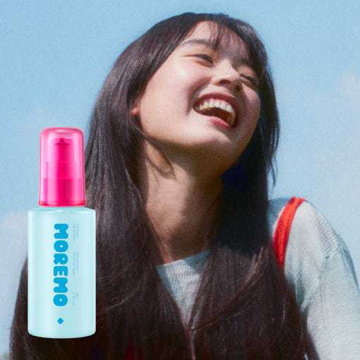 Moremo Pro Repair Essence - Hair Damage Solution bottle shown beside a woman with long, shiny hair, highlighting smoothness and shine benefits.