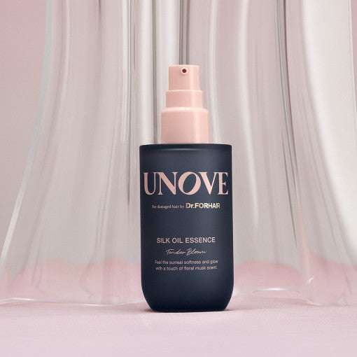 UNOVE Silk Oil Essence 70ml hair essence featuring elegant packaging, designed for silky-smooth hair repair and revitalization.