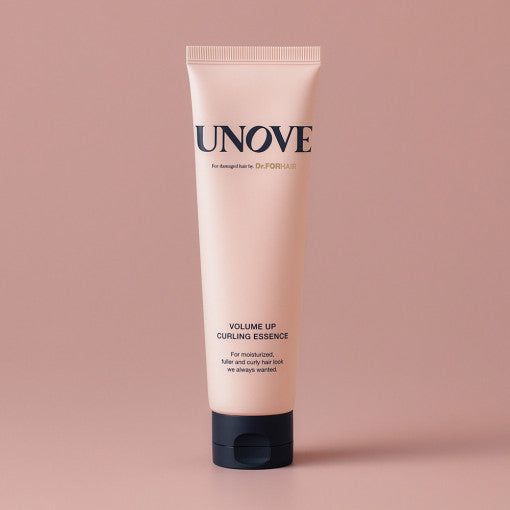UNOVE Volume Up Curling Essence 147ml being dispensed from the tube, showcasing its creamy texture for curl defining and hydration.