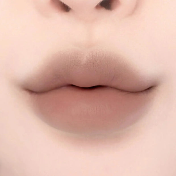 Lips featuring Lilybyred Smiley Lip Blending Stick 0.8g in a cool taupe shade, ideal for subtle definition and contouring.