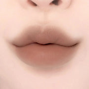 Lips with Lilybyred Smiley Lip Blending Stick 0.8g in a warm beige tone, offering a natural, plump look with soft matte texture.
