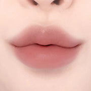 Lips wearing Lilybyred Smiley Lip Blending Stick 0.8g in a rosy nude shade, perfect for everyday wear with a smooth, blended finish.