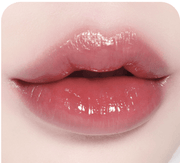 Lips wearing BBIA L'eau Tint 4.5g in a muted rose shade, offering a sophisticated, glossy finish with a barely-there feel.