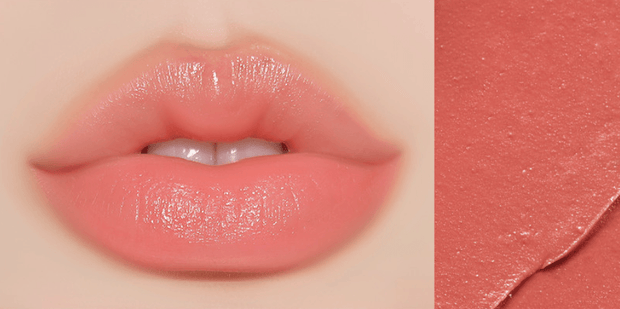 Huxley Lip Balm Leave Behind in soft coral shade displayed on lips with a smooth, dewy texture for a fresh, healthy look.