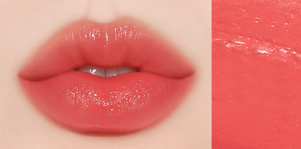 Huxley Lip Balm Leave Behind in vivid coral red shade on lips, combining bold color with a smooth, moisturizing formula.