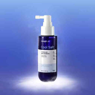 Dr.G Cooling Tonic - Scalp Refresh 100ml bottle with spray nozzle, designed for oil control and quick absorption on a radiant blue background.